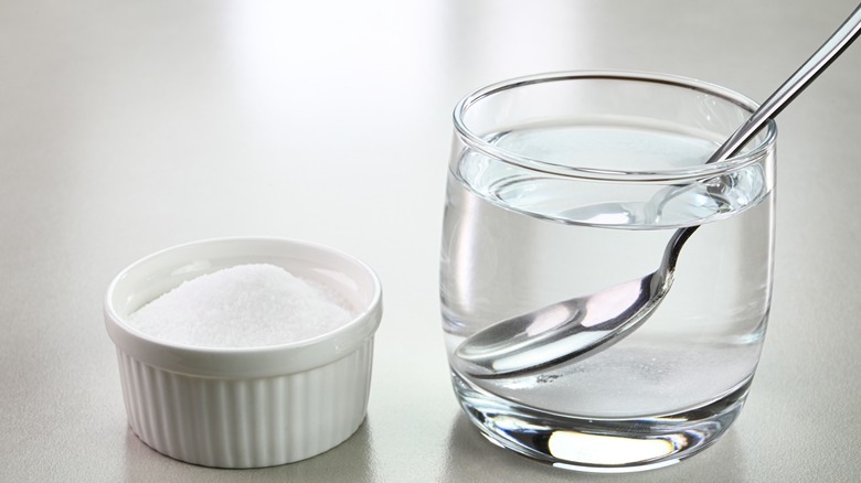 Mixing salt and water in bowl