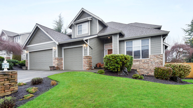 Grey home with lawn