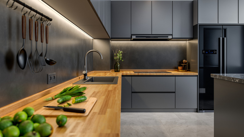 Matte black kitchen with wooden worktop