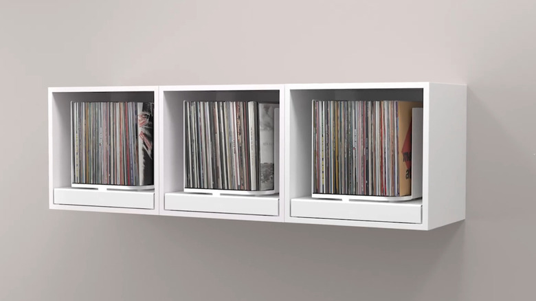 Three Toneoptic rpm cube storage units mounted on a white wall