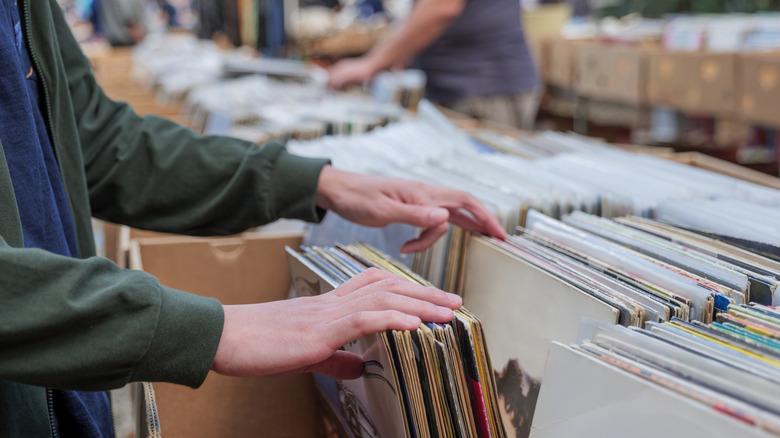 A person looking through records at a store