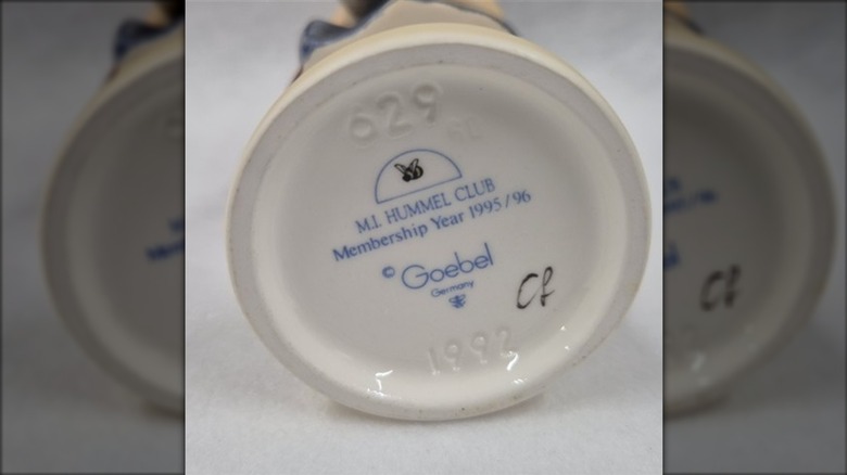 The bottom of a Hummel figurine with a stamp and year