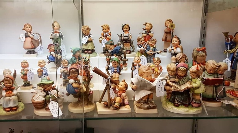A variety of vintage Hummel figurines on sale at a store