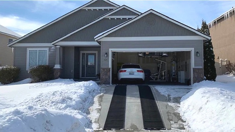 Two snow melting mats on residential driveway