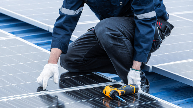 Professional installs rooftop solar on a home