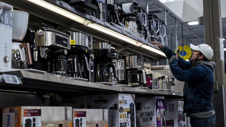 an array of coffee machines in a store