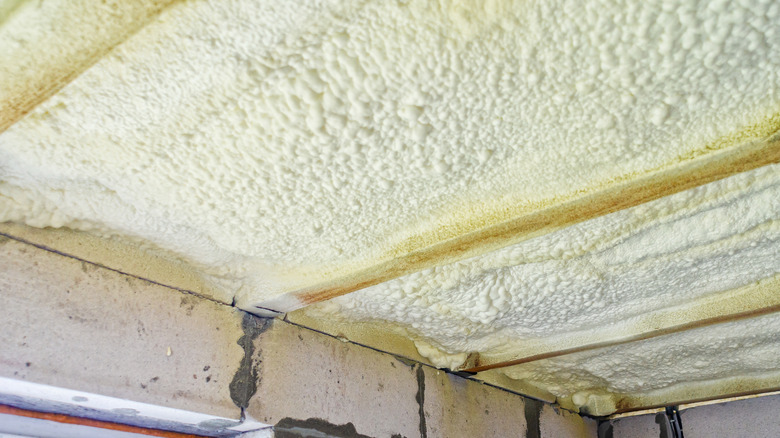 Spray foam on the ceiling of a home's basement.