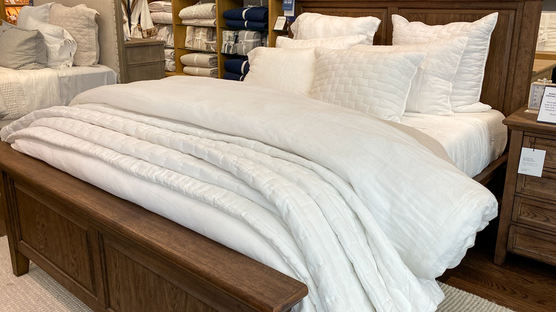 White bed in showroom