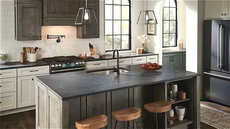 Kitchen with carbo brushed quartz countertops and island by Viatera.