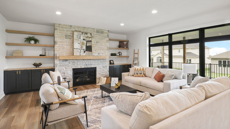 Neutral tone living room with colorful pillows and decor