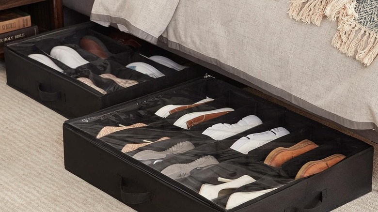 Shoes organized in black under the bed shoe storage container