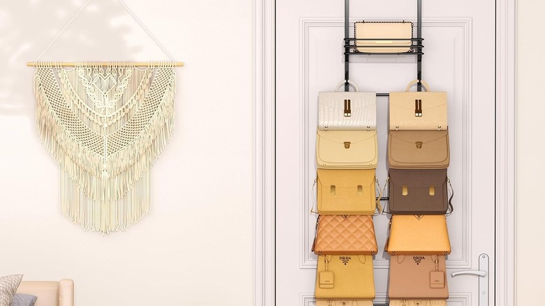 Over the door purse organizer showing off bag collection