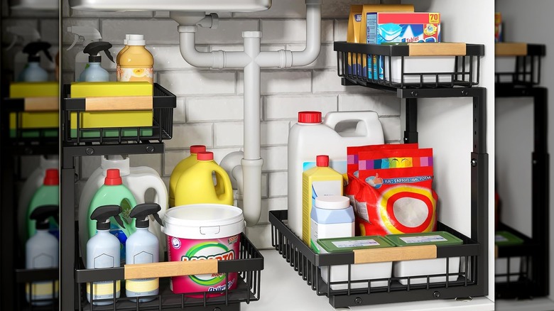 Kitstorack shelf under sink holding cleaning essentials