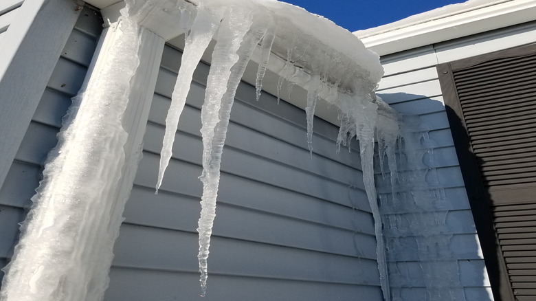 Thick ice build-up in home gutter system