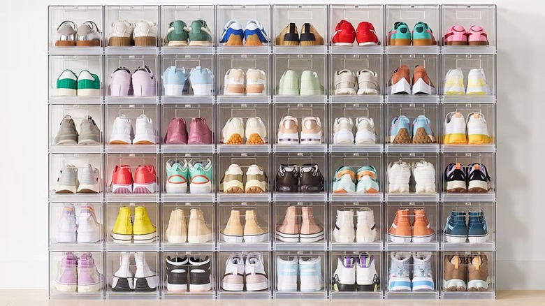 Multiple stacks of front-opening plastic shoe storage containers.