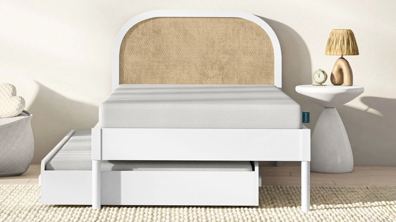 Trundle bed with wooden headboard