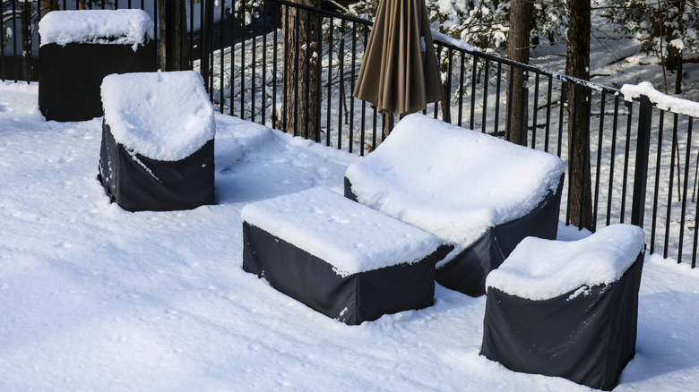 outdoor furniture covered in snow