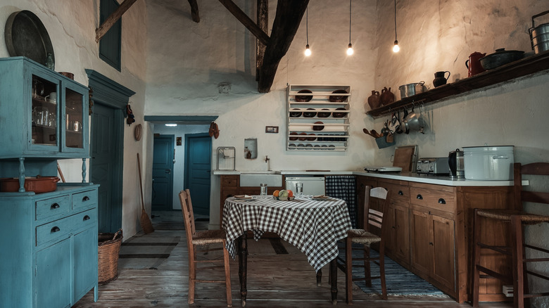 A rustic kitchen with natural wood furniture and cabinets