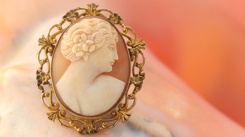 Cameo pin against a blurred background