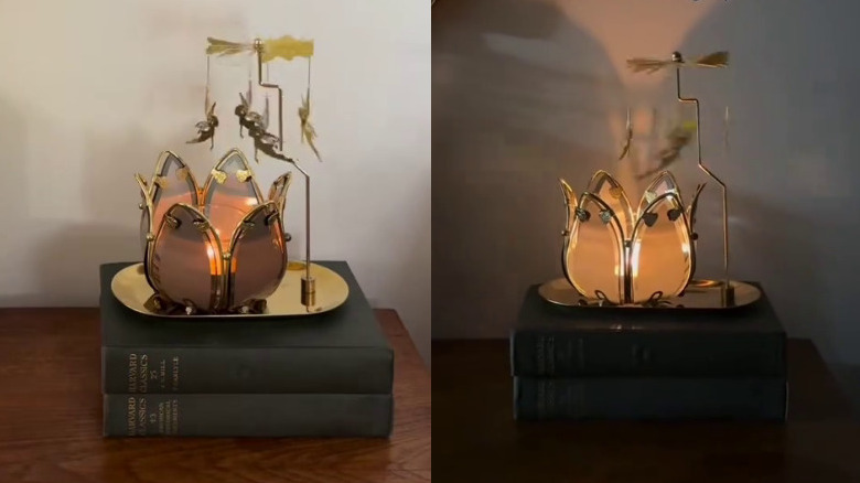 A vintage lotus candle holder with a spinning fairy candle carousel