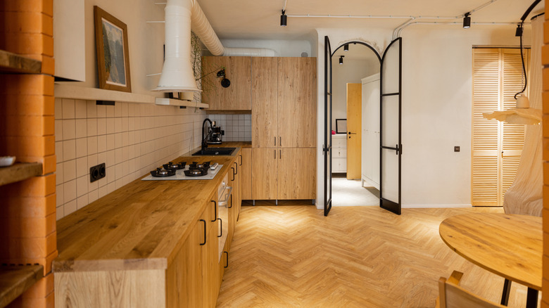 Wooden kitchen with arch doorway