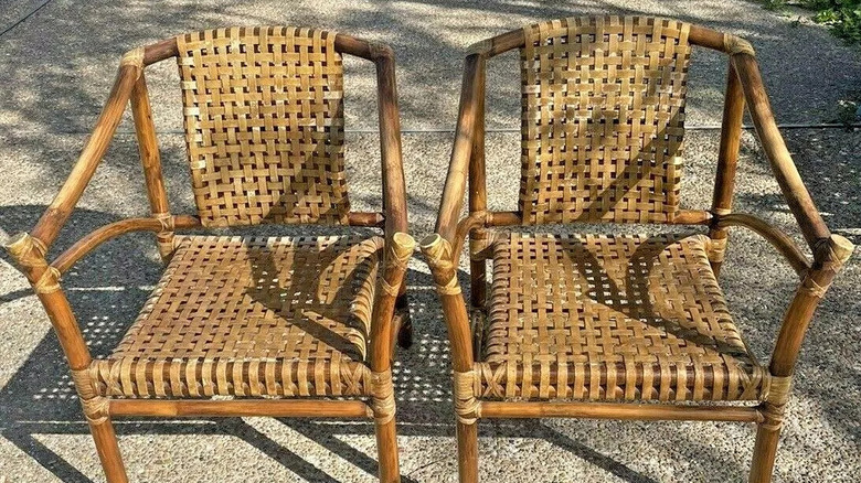 A pair of laced rawhide and rattan McGuire armchairs