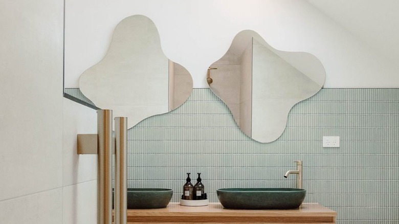 Two blob mirrors in bathroom