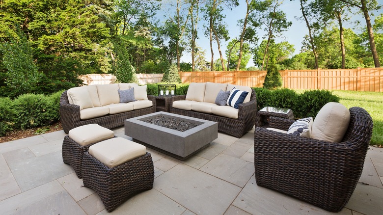 Outdoor patio with cream and brown colored furniture