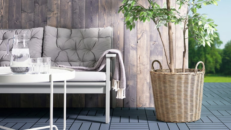 The IKEA FLODBJÖRK planter holds a plant outdoors