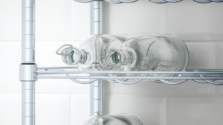 close up of empty glass bottles on OMAR wine rack