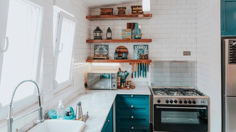 Light kitchen with reclaimed wood and blue cabinets