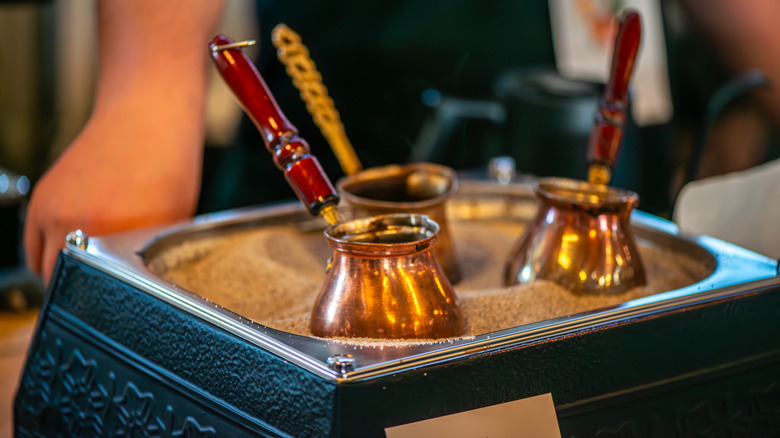 Turkish coffee pots on a stand