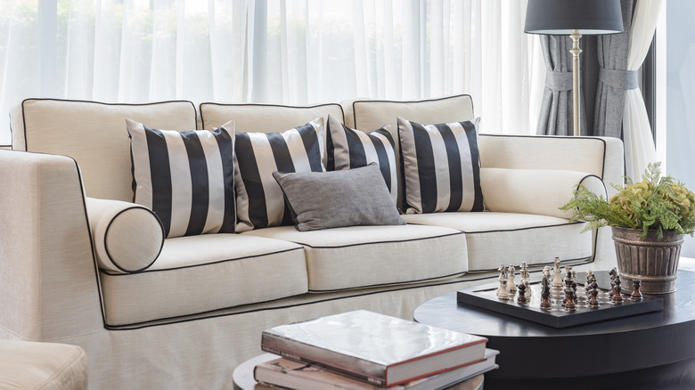 contrasting welts on couch with cushions arranged on it