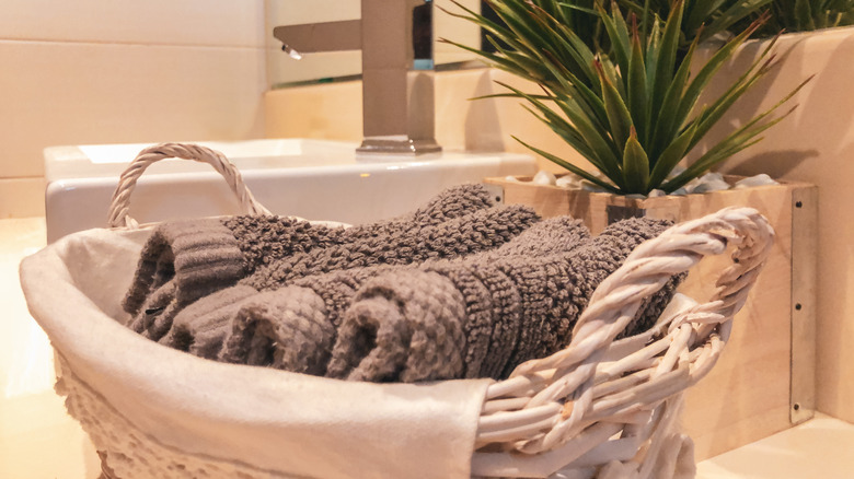 thick, luxury towels ready for use, displayed in an attractive basket