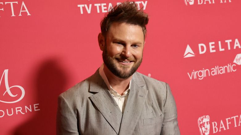 Interior design star Bobby Berk at a red carpet event