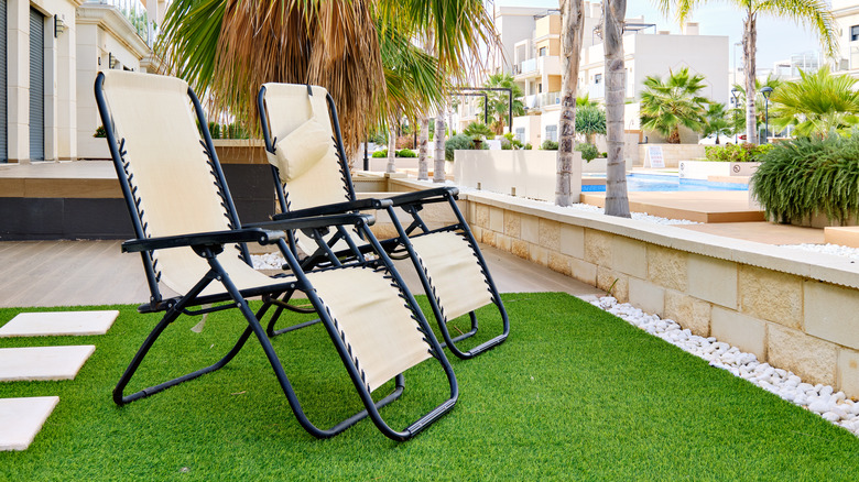 lawn chairs on artificial lawn 