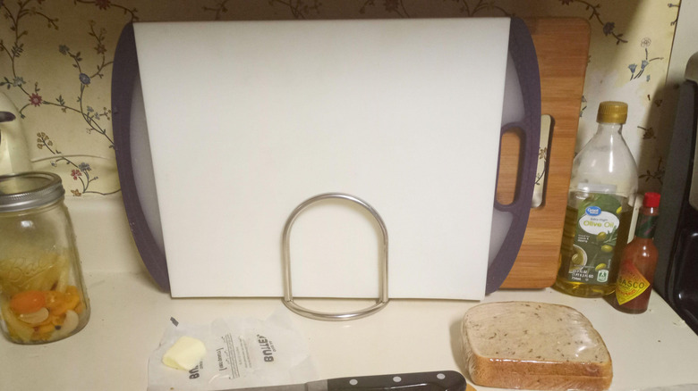 Cutting boards stored in a metal napkin holder