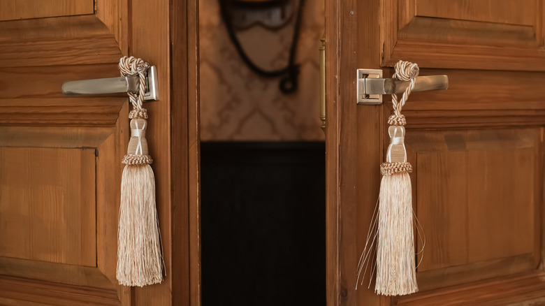tassels hanging from door knobs