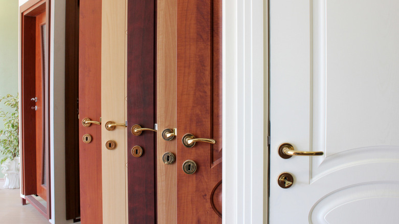 A display of open wood doors in various shades