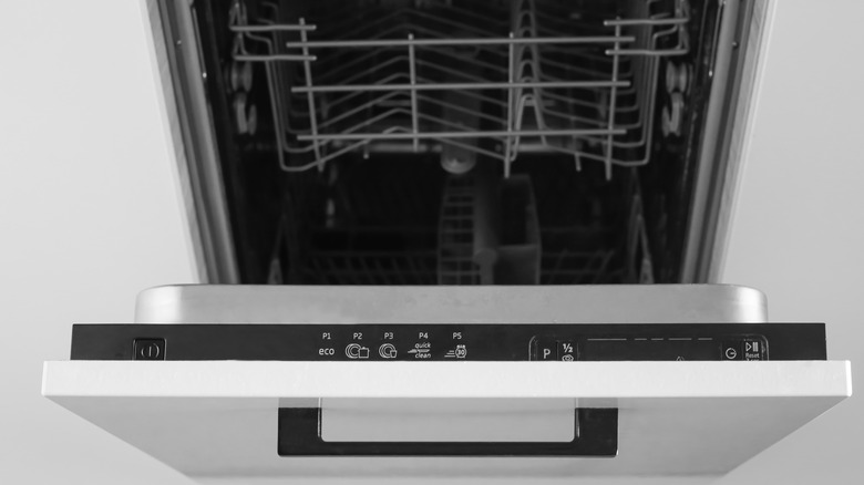 open dishwasher showing control panel