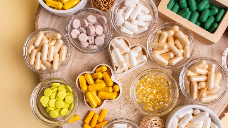various nutritional supplements in pill form displayed on table