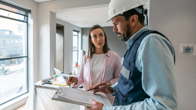 woman talking to home contractor