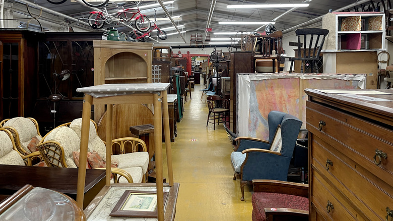 A furniture aisle in a second-hand store