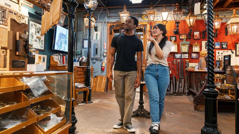 Couple looking through thrift store