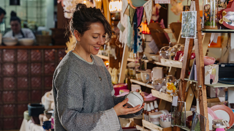 A woman shopping for vintage thrift store finds