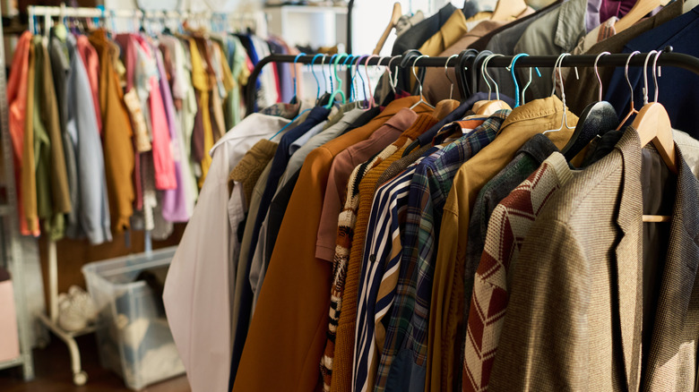 clothes hanging in a thrift store