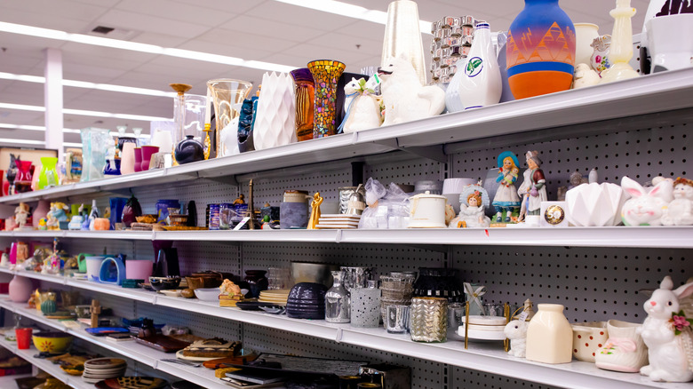 Thrift store shelves lined with knick-knacks and dishware