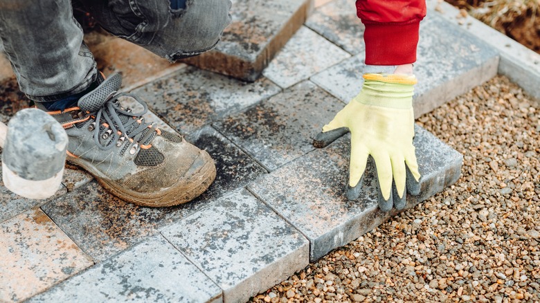 Laying bricks for garden path