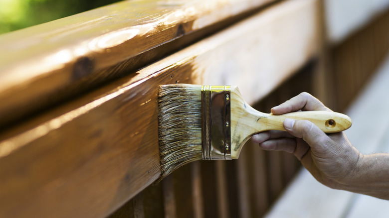Staining wood using brush