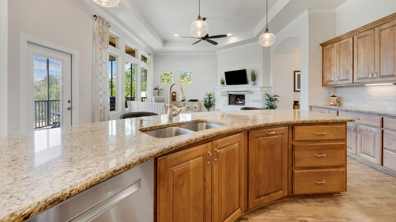 Honey oak cabinets in a light open space kitchen